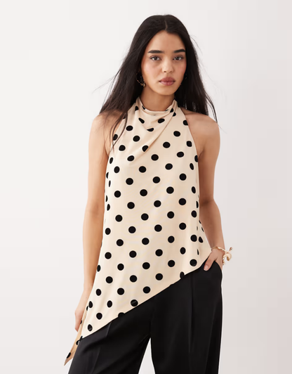 Flocked mesh halter neck longline top with asymmetric hem in black and off-white polka dots