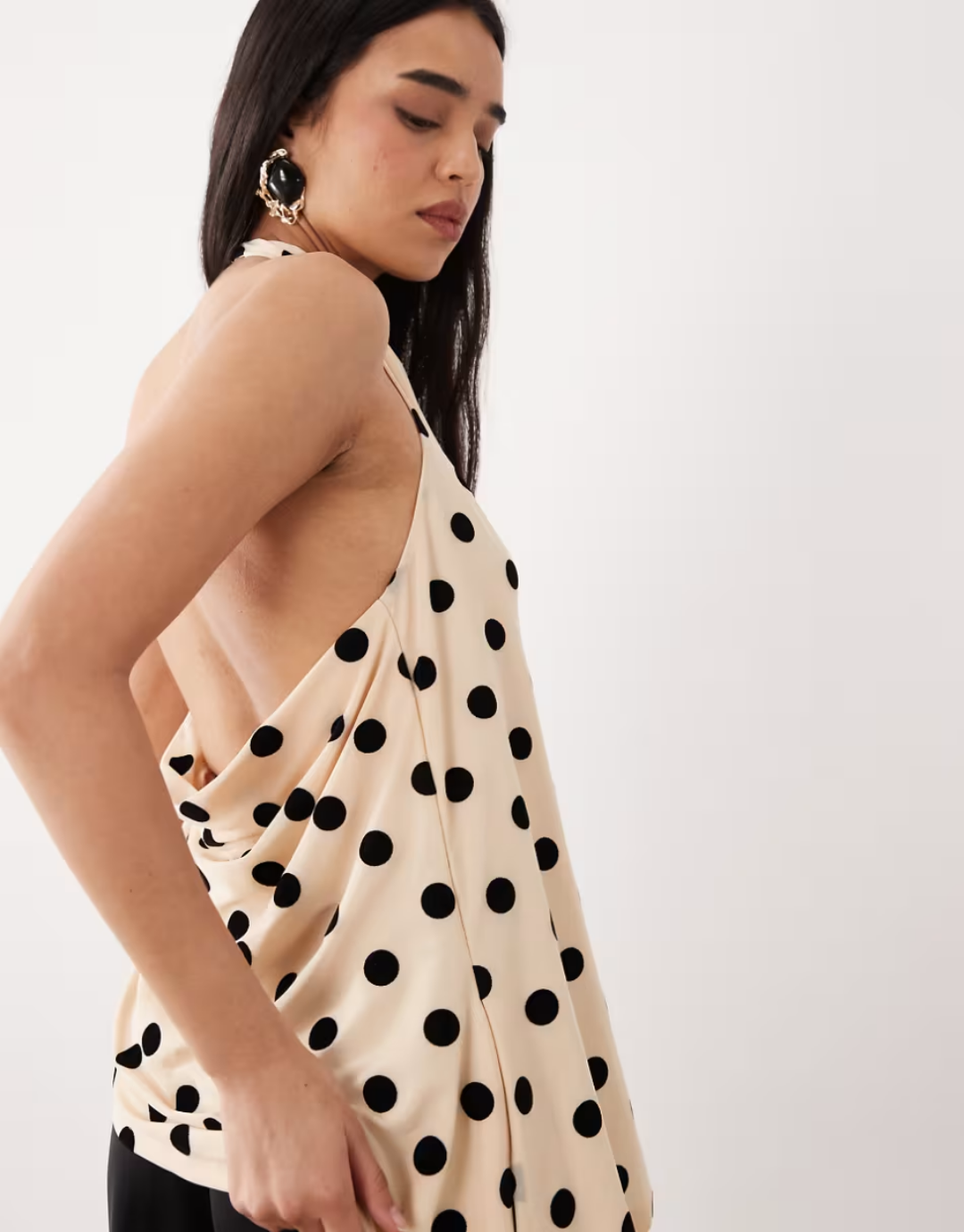 Flocked mesh halter neck longline top with asymmetric hem in black and off-white polka dots