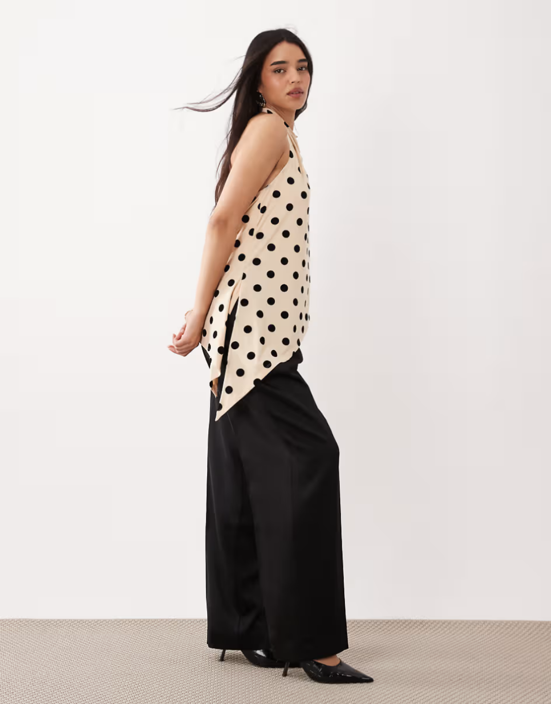 Flocked mesh halter neck longline top with asymmetric hem in black and off-white polka dots